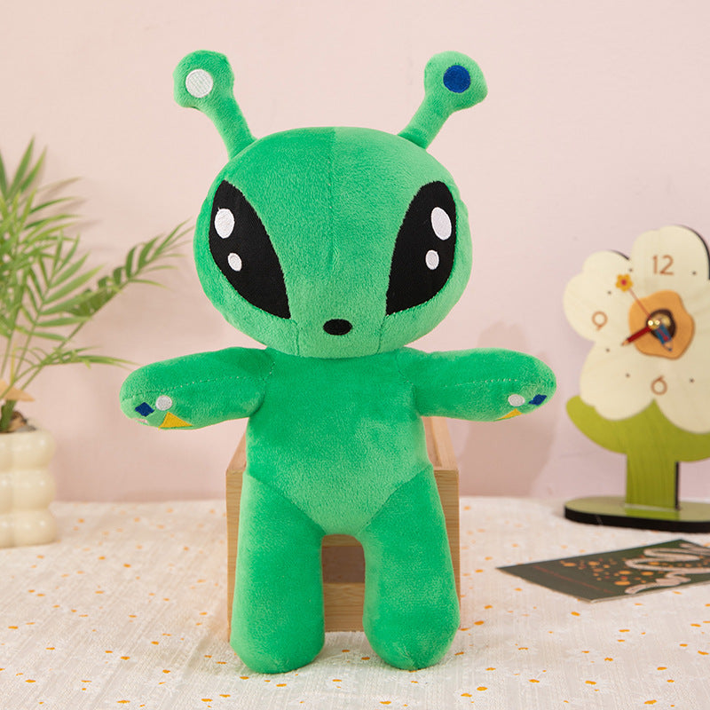 Green big eyed alien plush toy