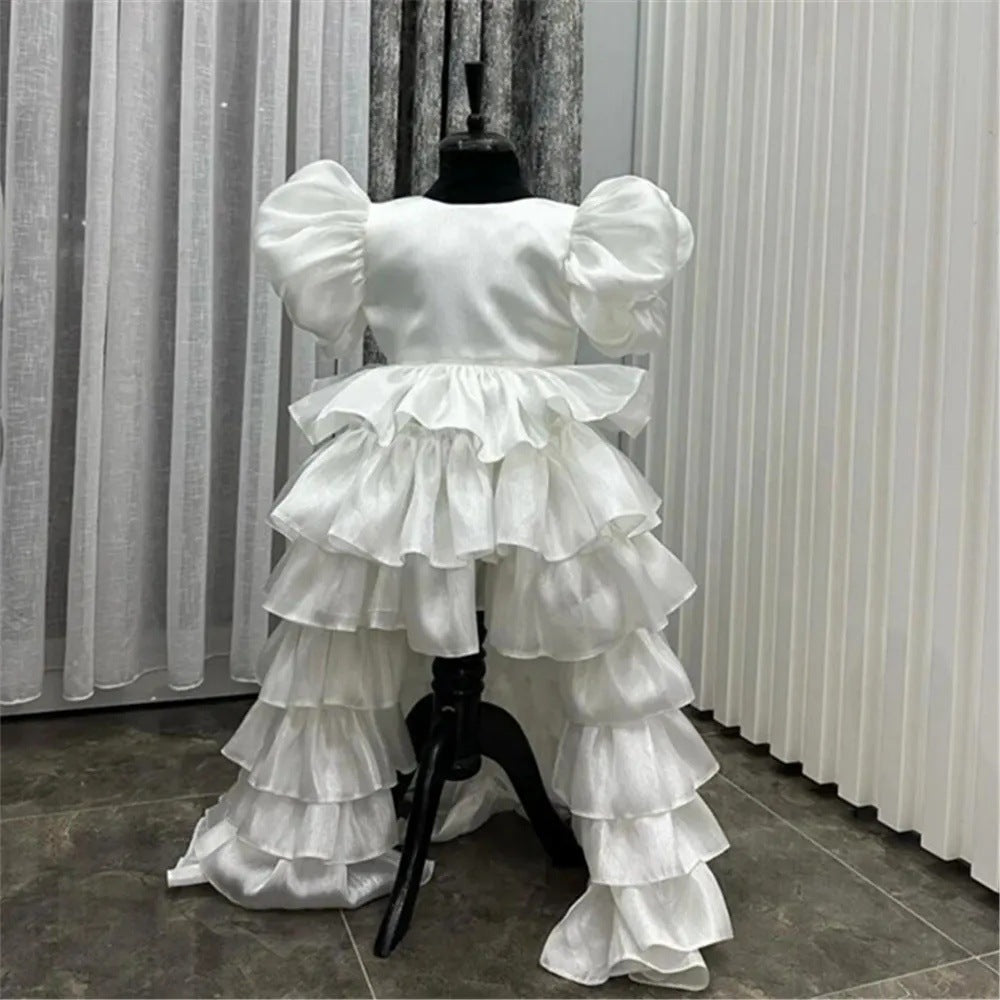 Girl's Birthday Banquet Princess Dress Children's Tail in white with ruffled layers and puff sleeves.